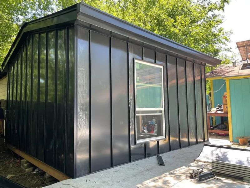 Black standing seam metal wall panels for Roof Inspection in North Branch